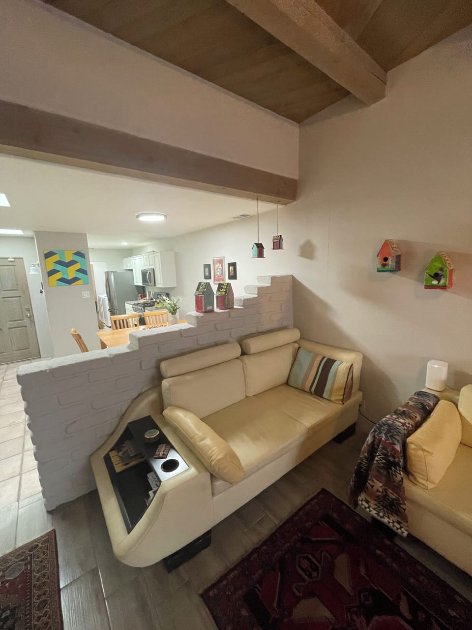 Authentic Adobe wall separates dining room from living room
