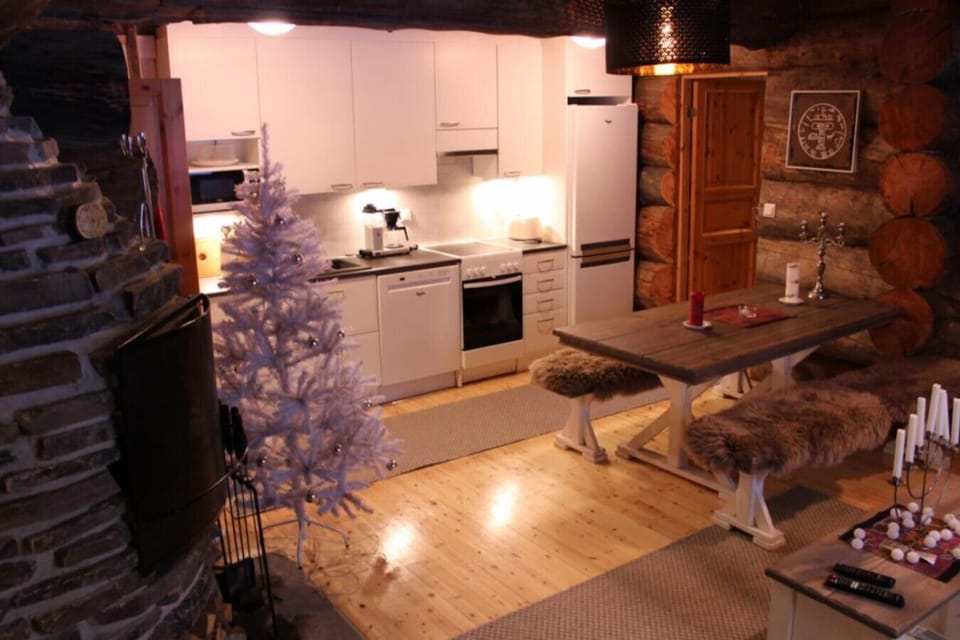 Open-plan kitchen and dining area with an electric stove and oven.