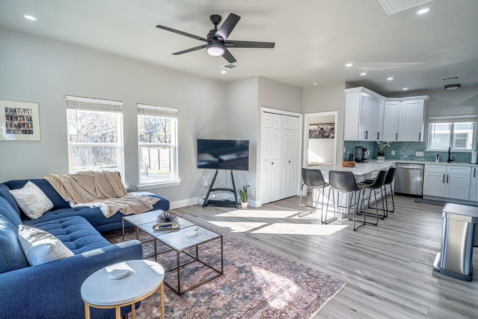 - Open concept
- Living room with 55” Roku TV
- Dining/kitchen island
