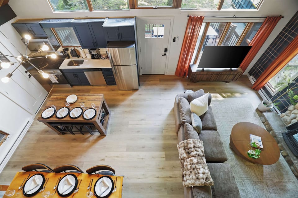 An open layout connecting the kitchen and living room means the whole group can cook, relax, and catch up without ever feeling separated.