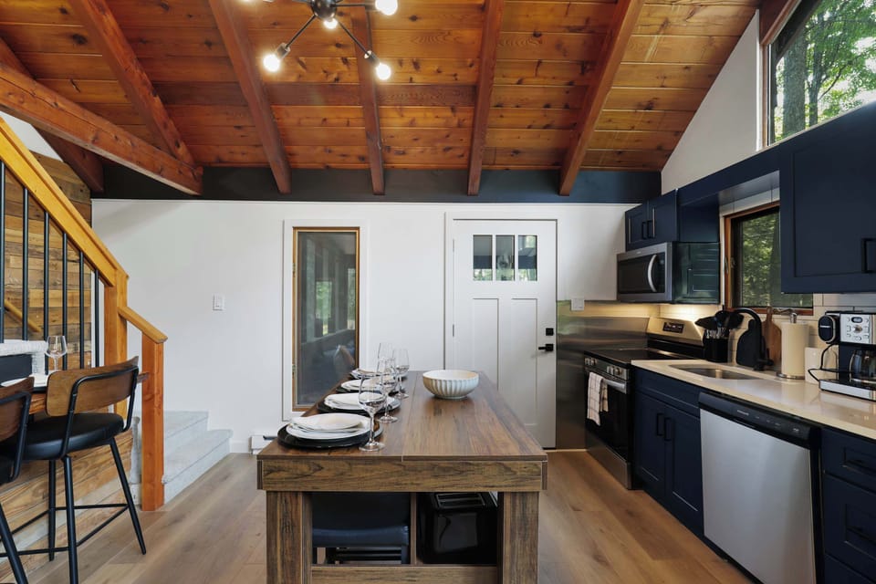 A fully equipped kitchen with island seating means everyone can gather round while dinner comes together, no cramped elbows required.