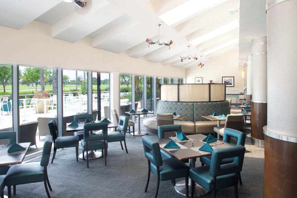 Dine comfortably in an airy room with expansive outdoor views.