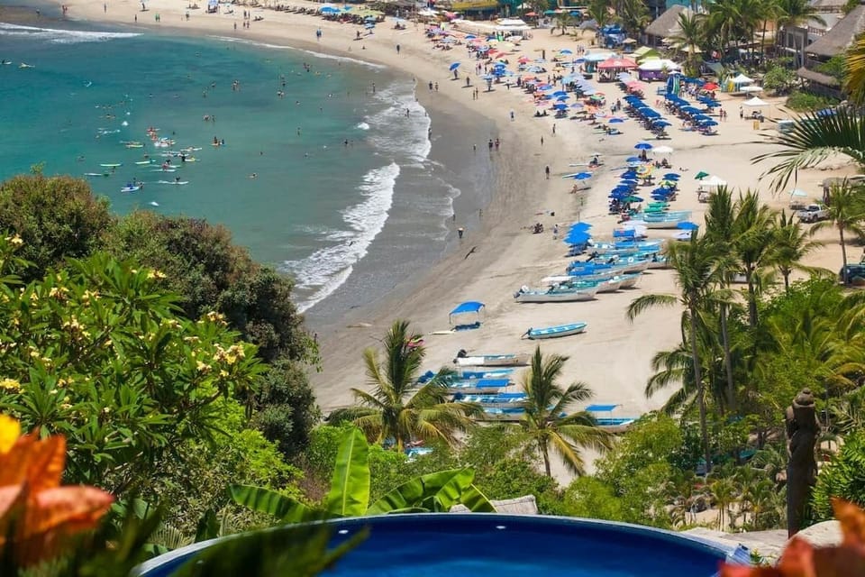 View from pool into town and the beach.