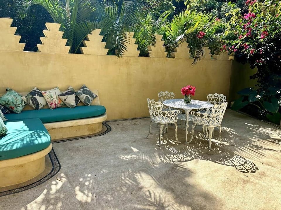 Outdoor garden with sitting area.