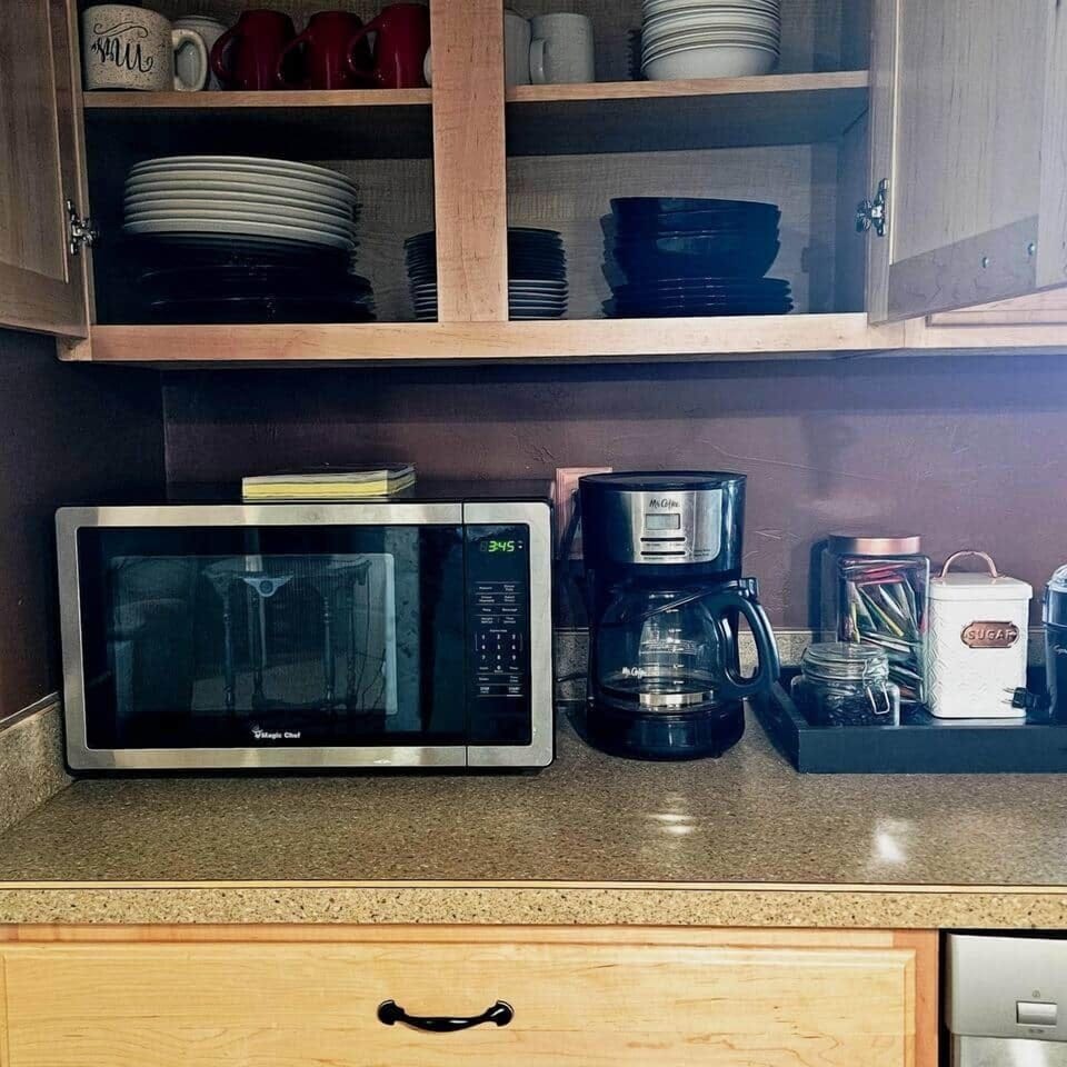 Fully stocked with dishes, fresh coffee beans to grind or ground coffee always in the freezer. Also a large tea supply and sweeteners at the ready.