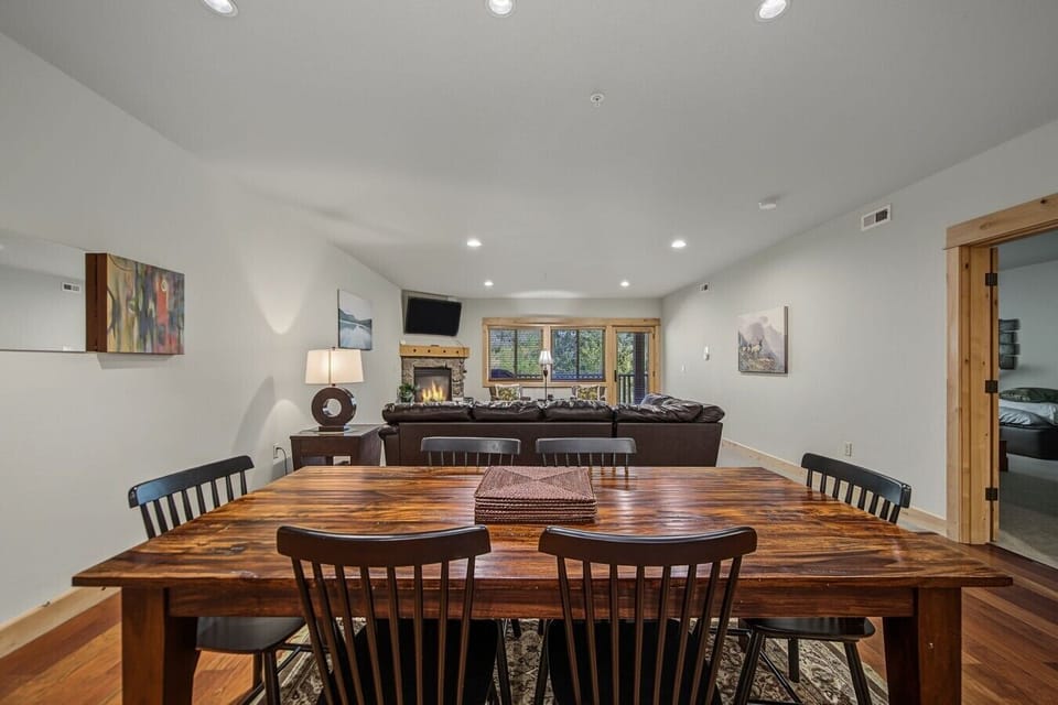Dinning table with a look at door to Primary bedroom and living room