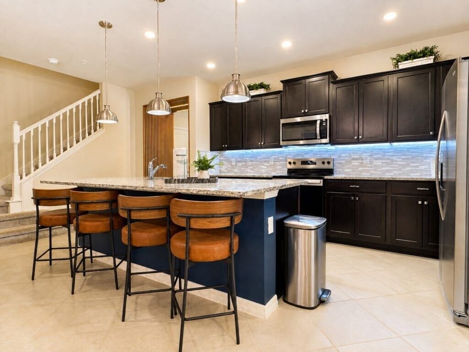 Fully equipped kitchen with large island, bar seating and plenty of space for group meals.