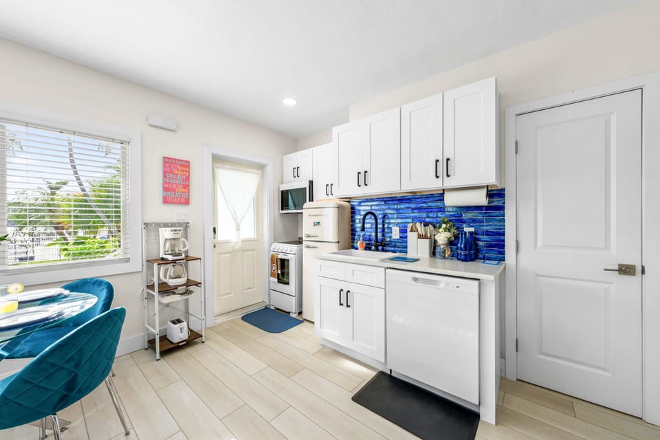 The efficient single-level layout puts the kitchen, dining table, living area and bathroom all within a few steps of one another — easy, breezy and ideal for couples or a small family.