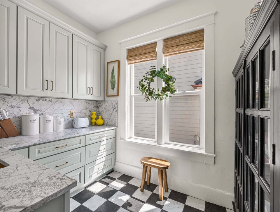 Dedicated storage space efficiently organized to keep culinary essentials accessible and orderly. Well-appointed with shelving and thoughtful storage solutions, the pantry supports the kitchen's functionality and keeps the main cooking area uncluttered. A practical extension of the kitchen that provides everything needed for well-stocked entertaining.