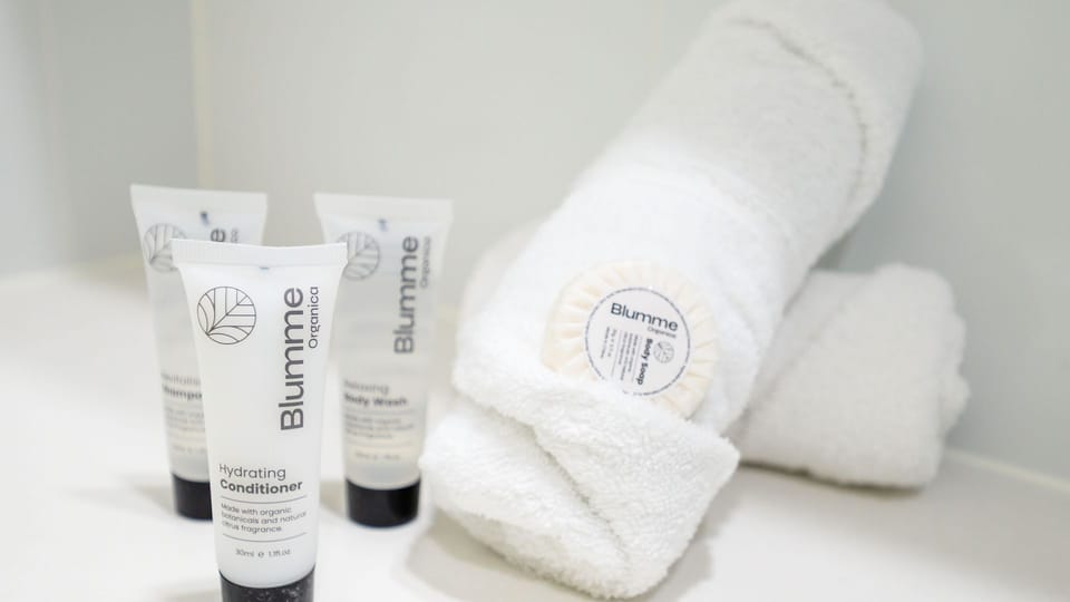 Fresh towels and complimentary bathroom amenities