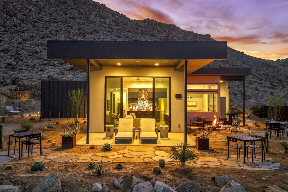 Modern desert retreat with mountain views, fire pit, and inviting patio