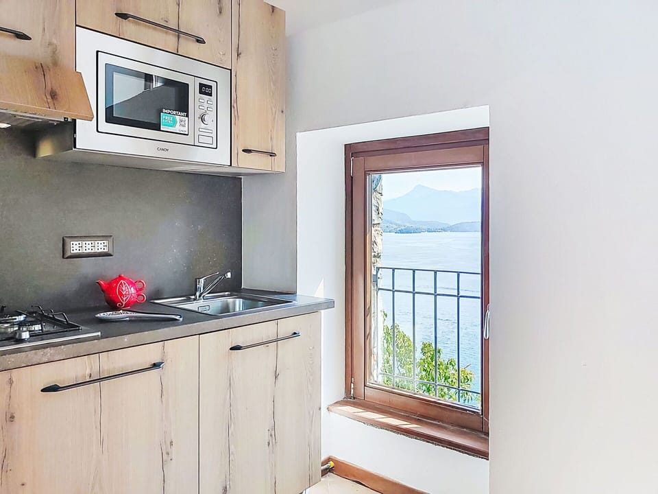 Room, Apartment, Balcony, Wood Stain, Kitchen Sink, Hardwood, Chair, Plumbing Fixture, Kitchen, Sink