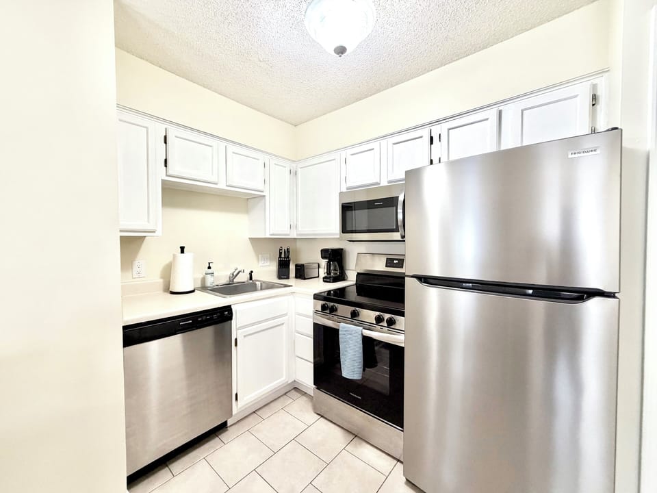 Bright kitchen with stainless appliances and everything needed for easy meals