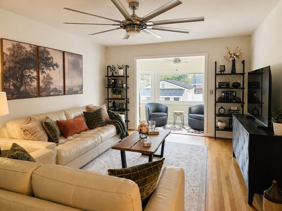 Bright designer living room with sunroom seating and stylish modern touches