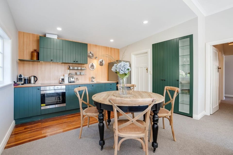 Dining area and fully equipped kitchen with a Nespresso machine, coffee pods, coffee and tea provided