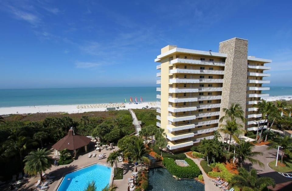 Beachfront resort with pool, tropical grounds, and direct beach access
