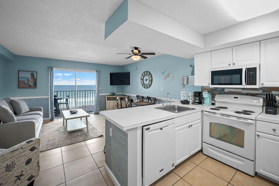 Fully equipped kitchen with both drip and Keurig coffee makers, cookware and essentials for easy meals at the condo