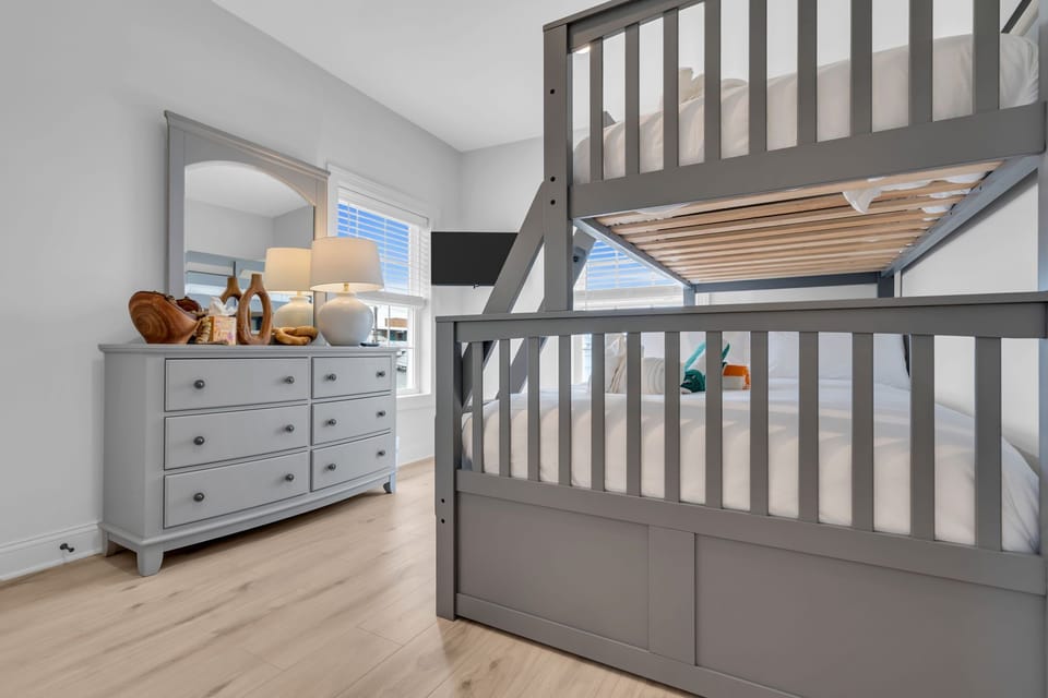 Bright family-friendly bunk room with stylish storage and natural light