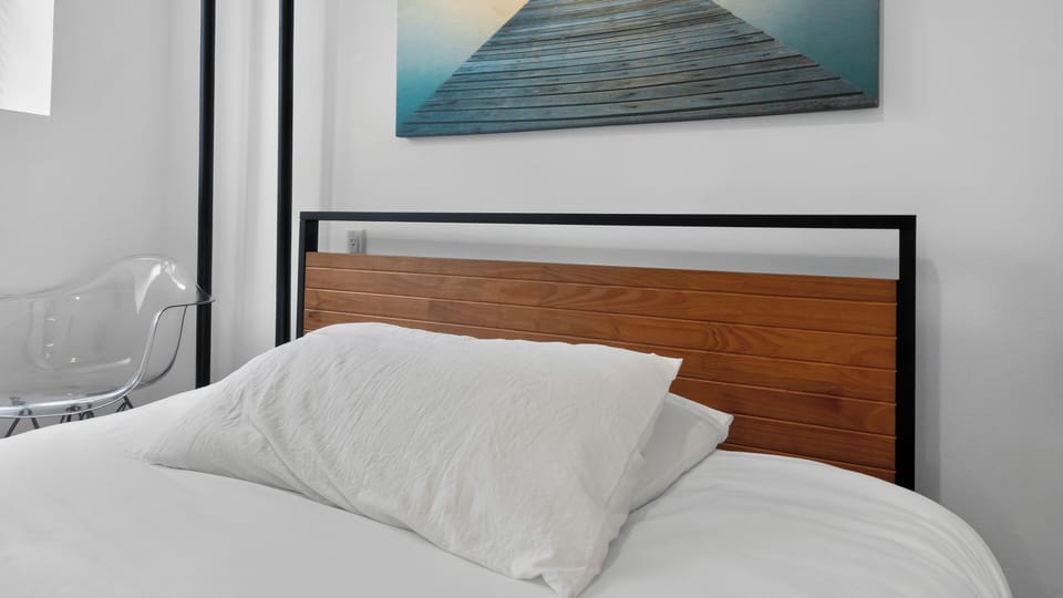 Modern minimalist bedroom with crisp linens and stylish decor