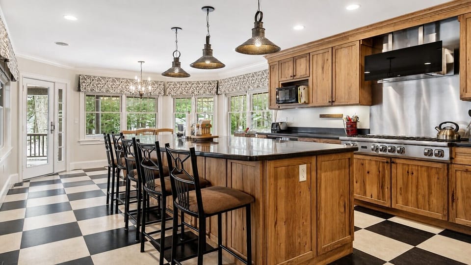 Gather around the spacious kitchen island, where the abundant natural light create the perfect setting for cooking