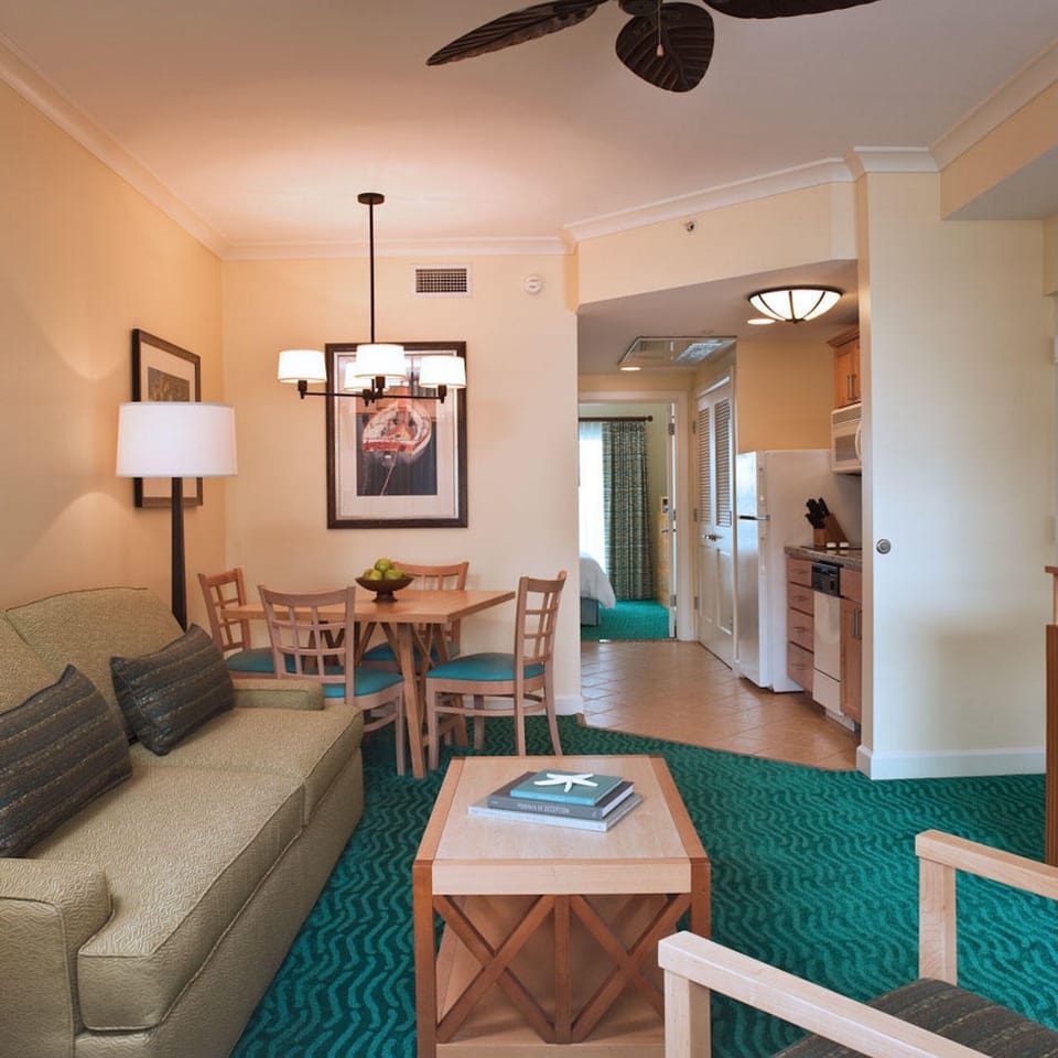 Bright open living space with dining nook and full kitchen access