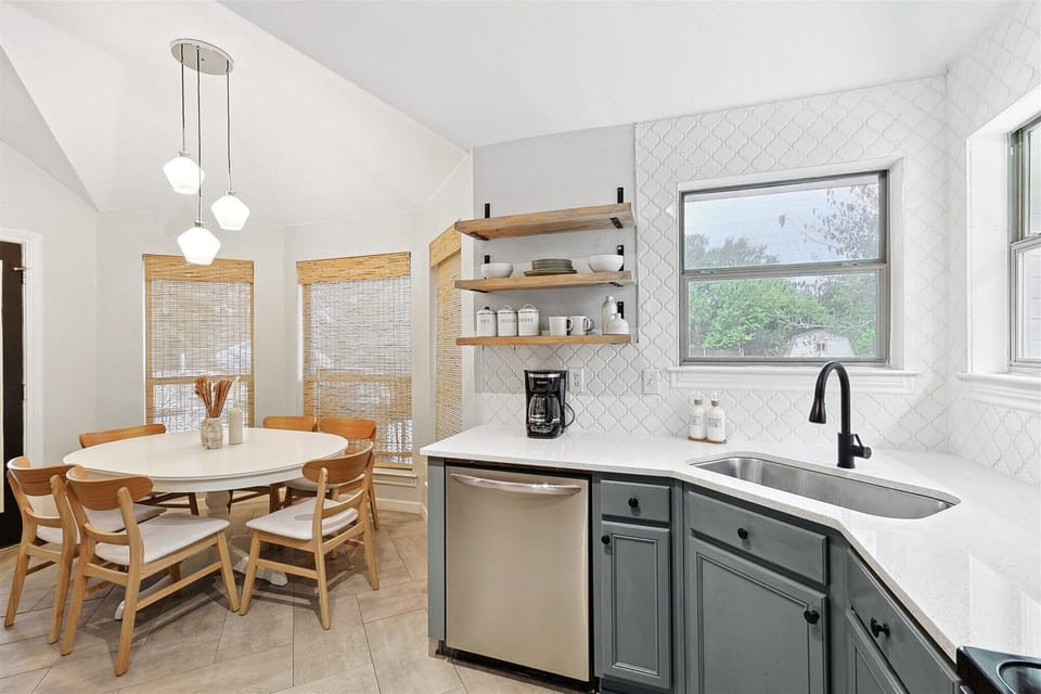 A spacious, modern kitchen where cooking becomes a joy, offering plenty of room to gather, prep and entertain with ease.
