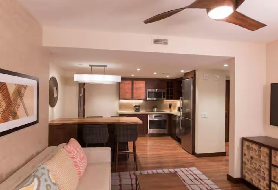 Modern open living space with full kitchen and cozy breakfast bar
