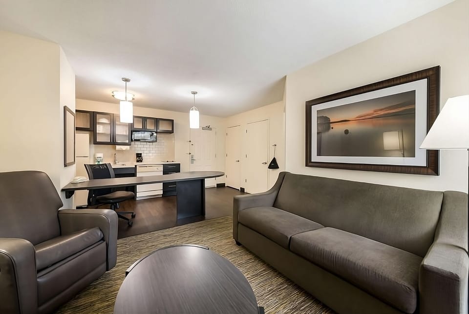 Bright, cozy living room with comfortable seating — ideal for relaxing after a day out