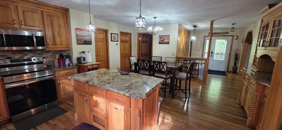 Granite countertops, beautiful custom cabinets, new appliances, fully stocked