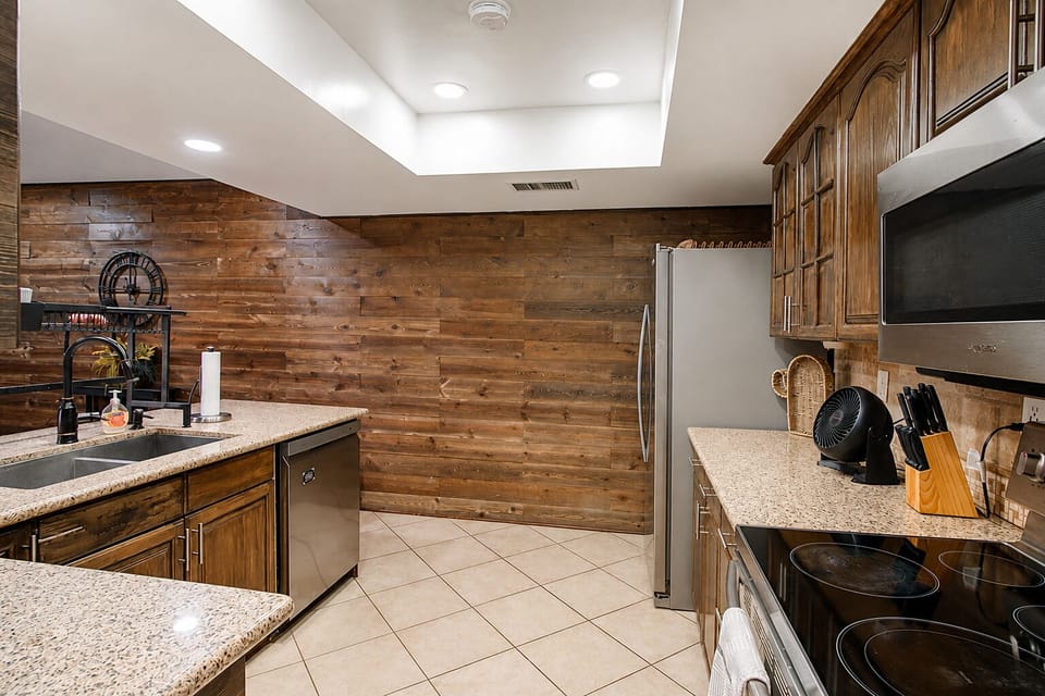 Experience a beautiful, rustic culinary space highlighted by a stunning wood-pan