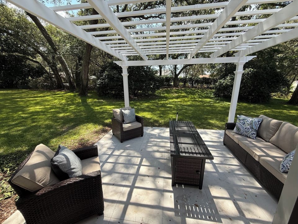 Your outdoor patio area, surrounded by live oaks trees.