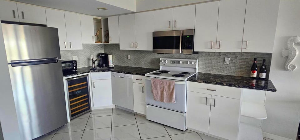 Full kitchen with silent appliances.