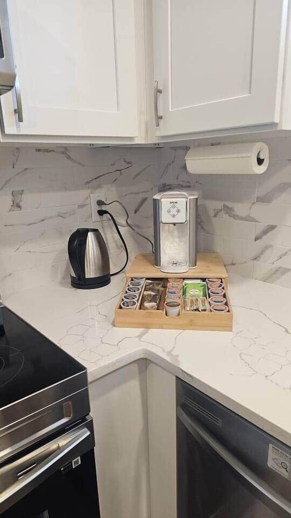 A variety of coffee flavors, tea, and a coffee maker and electric kettle  for your use.
