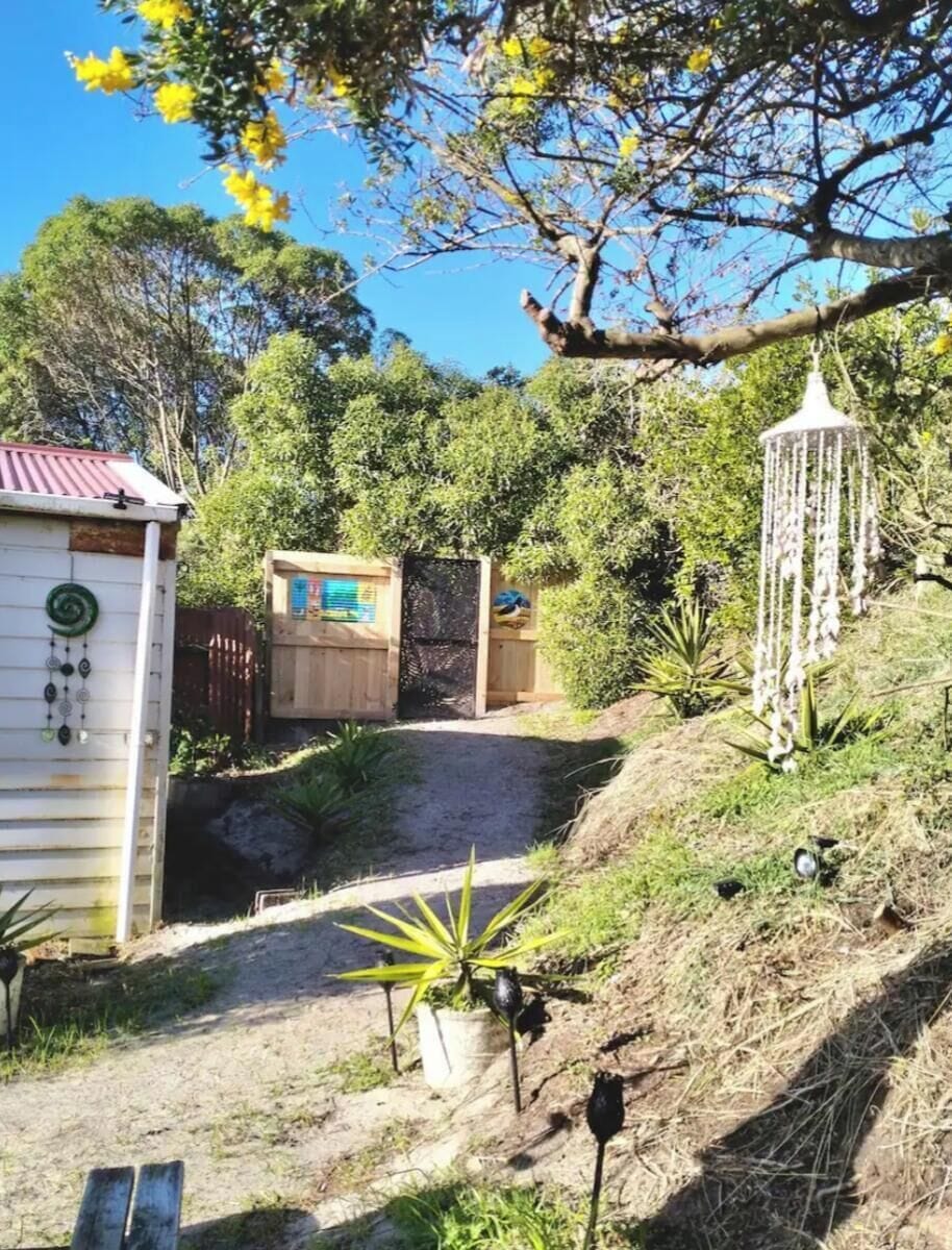 Back yard access to sea view and track to the beach through gate.