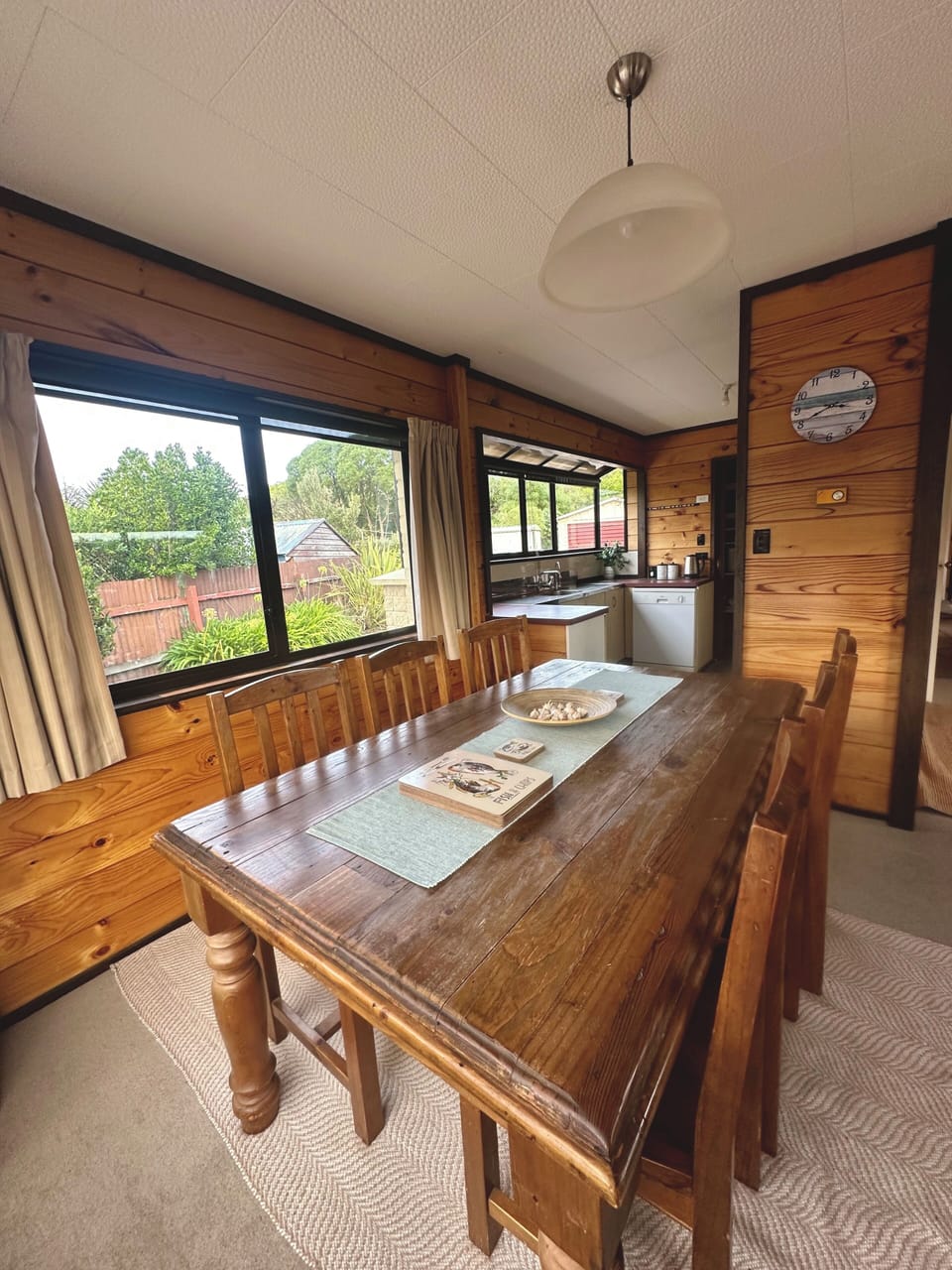Dining table for 6, with a highchair available in the kitchen pantry.