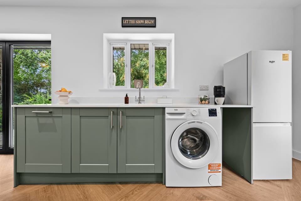 The fully equipped kitchen at Blue Puffin Stays make it easy to enjoy a home-cooked meal with family plus a ready-to-use washing machine for added convenience in doing your laundry