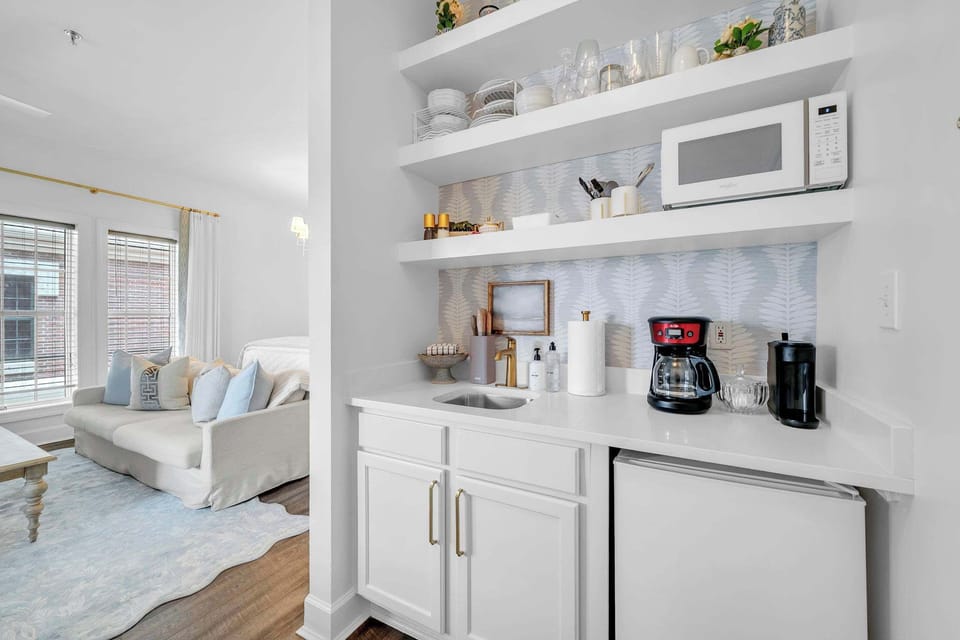 Kitchenette in condo features a Keurig/Drip coffee maker, mini fridge/freezer, and dishes!
