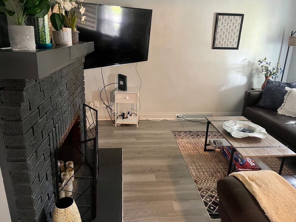 Front living room with smart tv and large sectional sofa