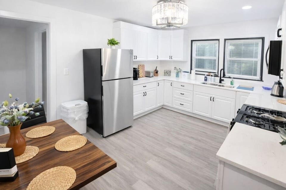 Our fully equipped, modern kitchen offers a spacious and functional layout with ample counter space and all the essential cookware needed to easily prepare home-cooked meals during your extended stay.