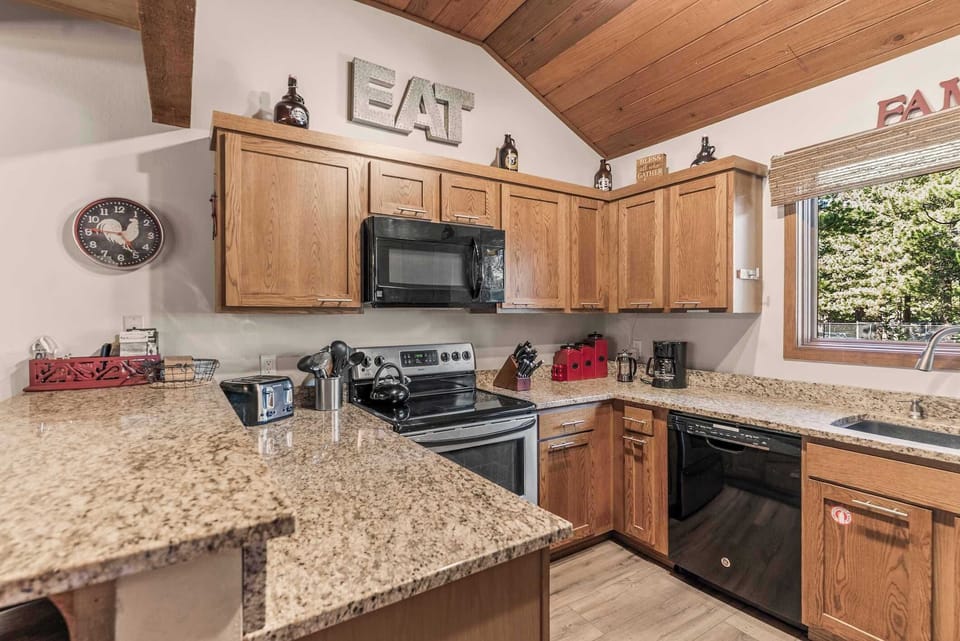 Open dining and kitchen with vaulted ceilings