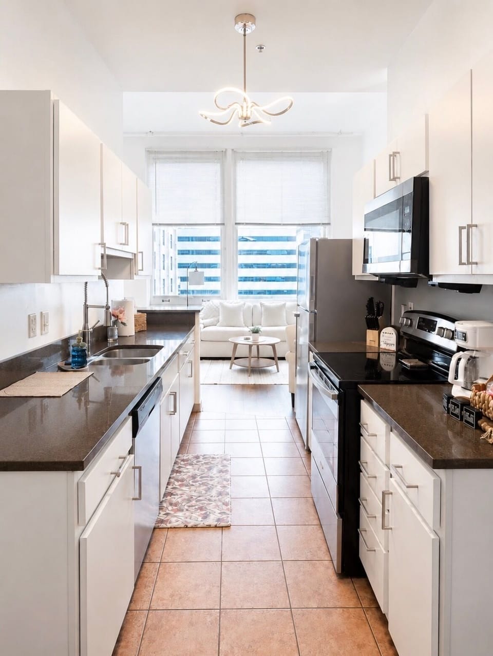 Bright modern kitchen with stainless appliances and sunny window nook