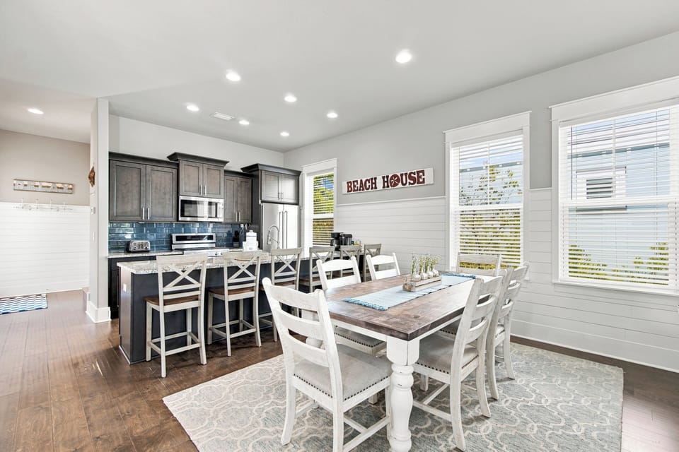 Gather around the spacious dining table or cozy up at the kitchen island—your beach house retreat is ready for shared meals, morning coffee, and coastal relaxation.