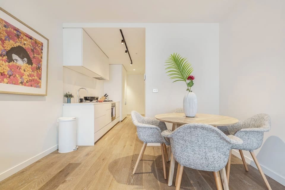 A small dining tables creates the space to sit down together for a meal at home, making use of the modern kitchen.
