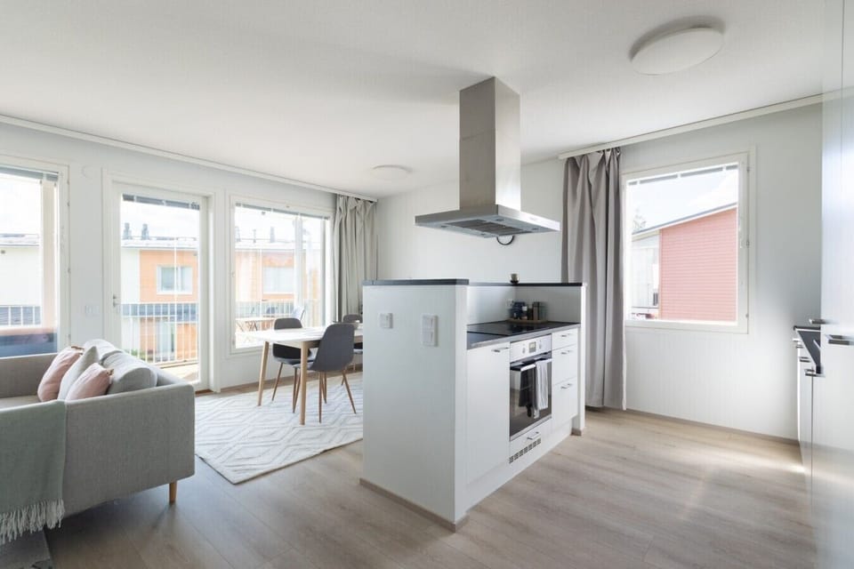 Kitchen island with induction cooktop, oven, and dining by the balcony, Padisentie 8 C 12