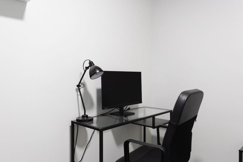 Dedicated workspace with monitor, desk lamp, and office chair, Padisentie 8 C 12