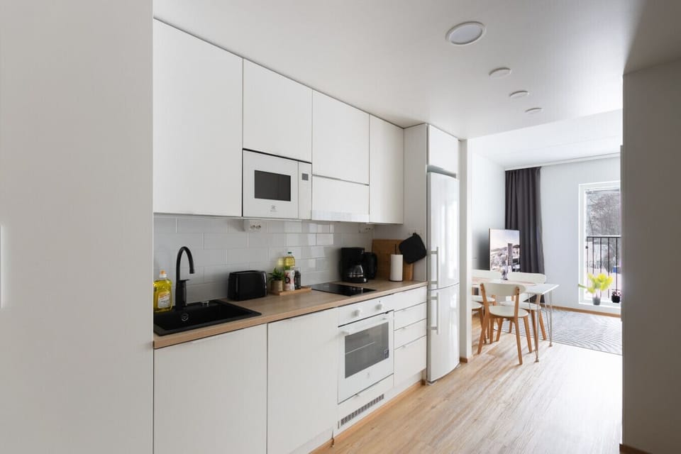 The kitchen is modern and fully equipped