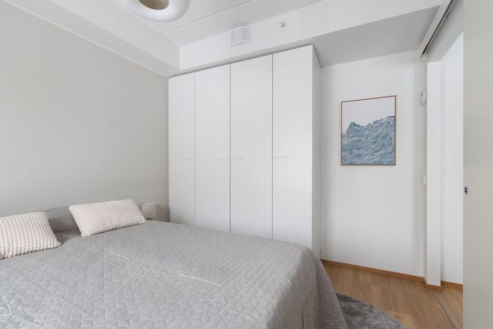 The bedroom also has plenty of cupboard space