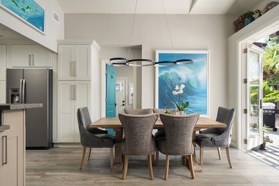 Dining Room | Elegant dining area that flows into the kitchen, with French doors opening to the backyard.