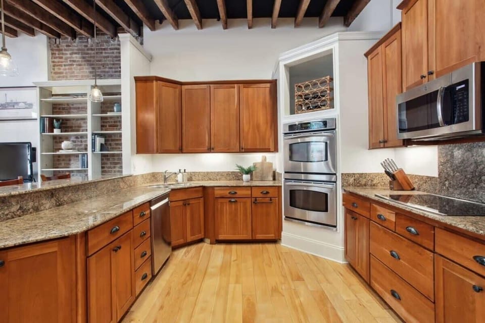 Kitchen | Kitchen with Stainless Steel Appliances and Natural Light | Third Floor of Building — Unit on One Level