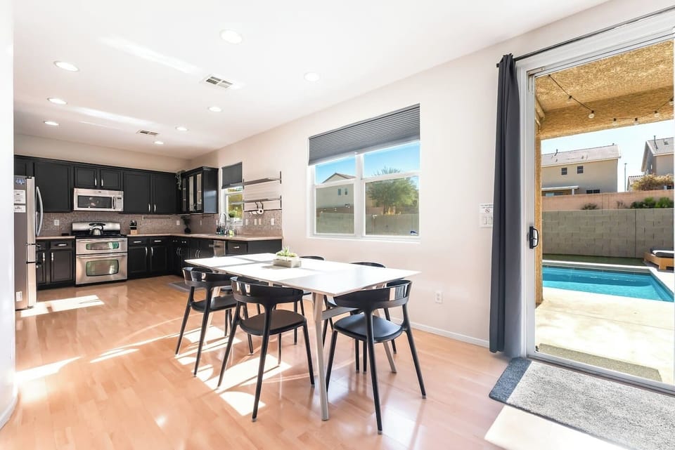 Dining area, table fits 6 comfortably but could squeeze in 8 people.